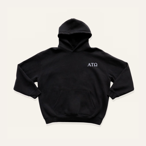 Black hoodie on a cream background with 'Alpha Tau Omega' greek letters in white on the left side chest.