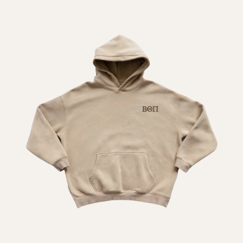 Beige hoodie on a cream background with 'Beta Theta Pi' greek letters in brown on the left side chest.