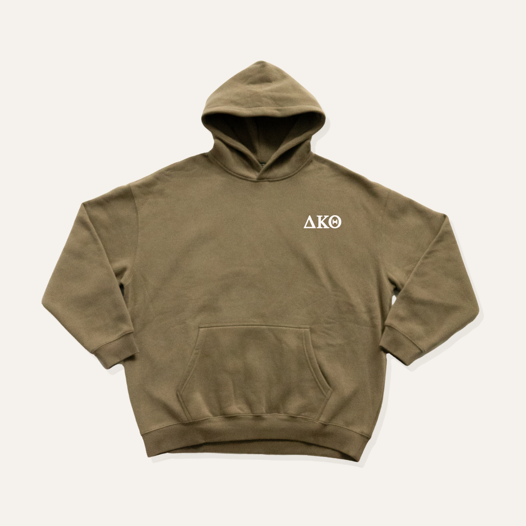 Olive green/grey hoodie on a cream background with 'Delta Kappa Theta' greek letters on the right side near the hood in white lettering.