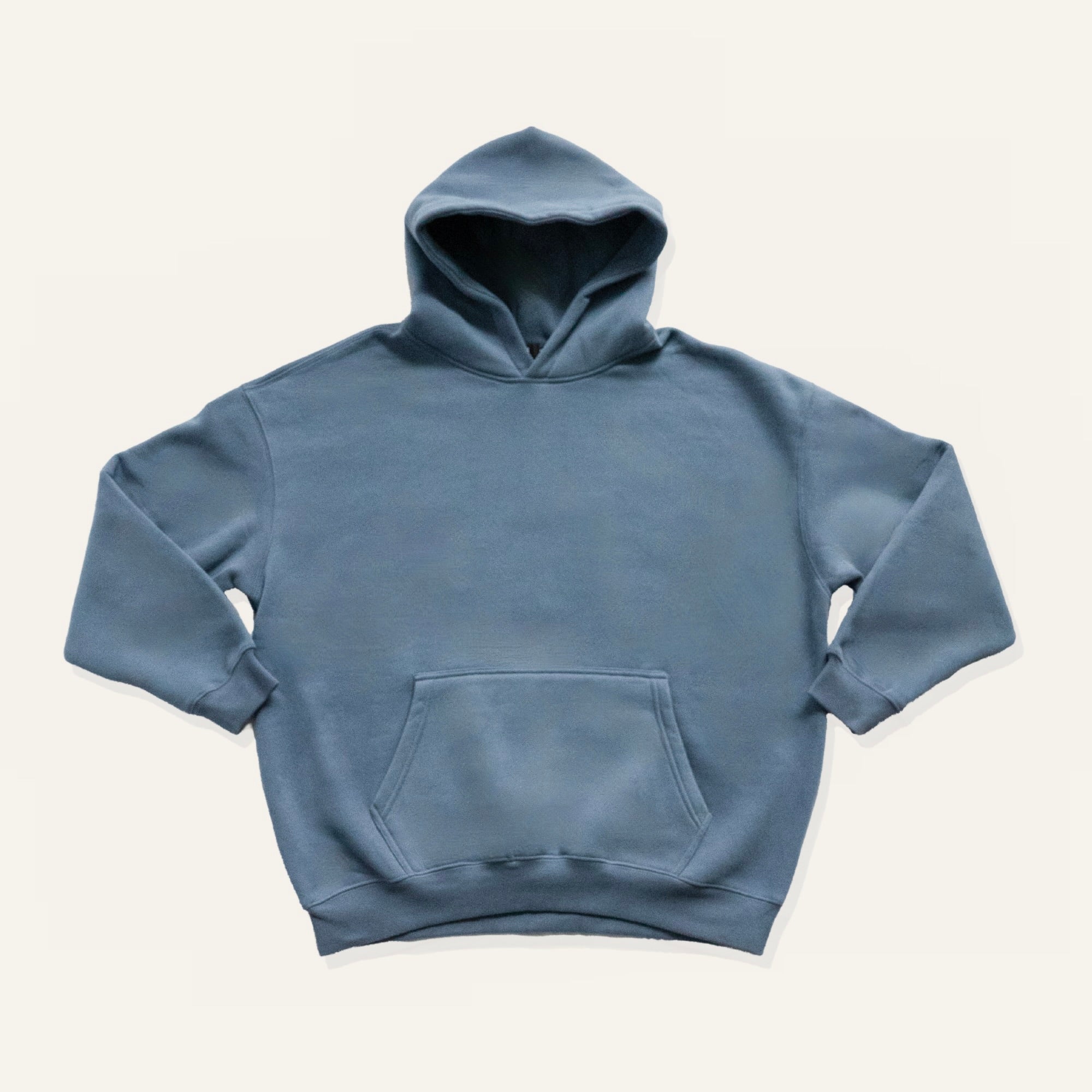 denim blue hoodie on a cream background