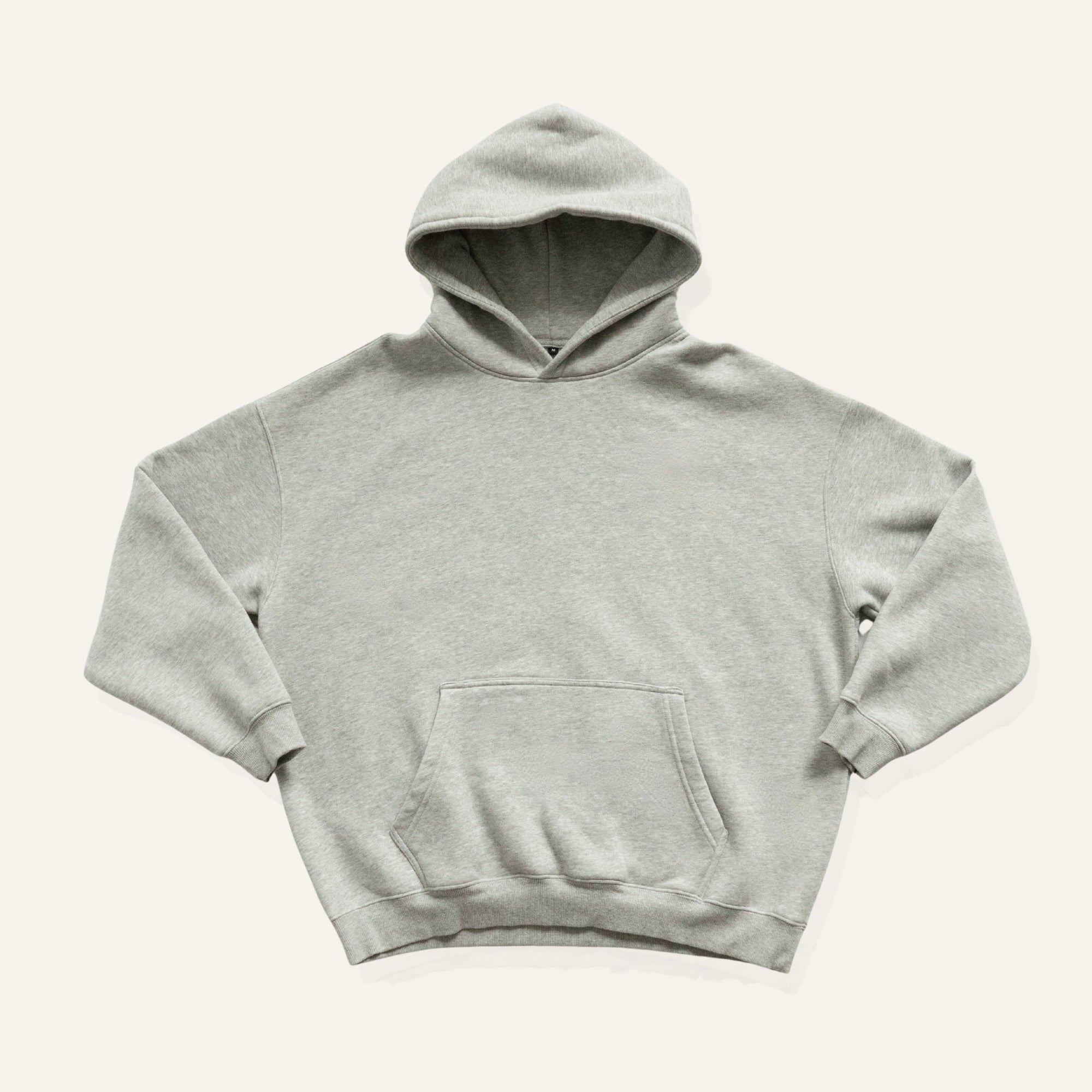 Light gray hoodie on a cream background