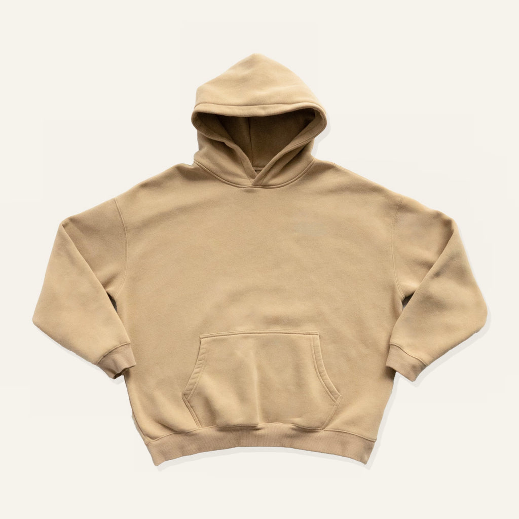 Beige hoodie on a cream background