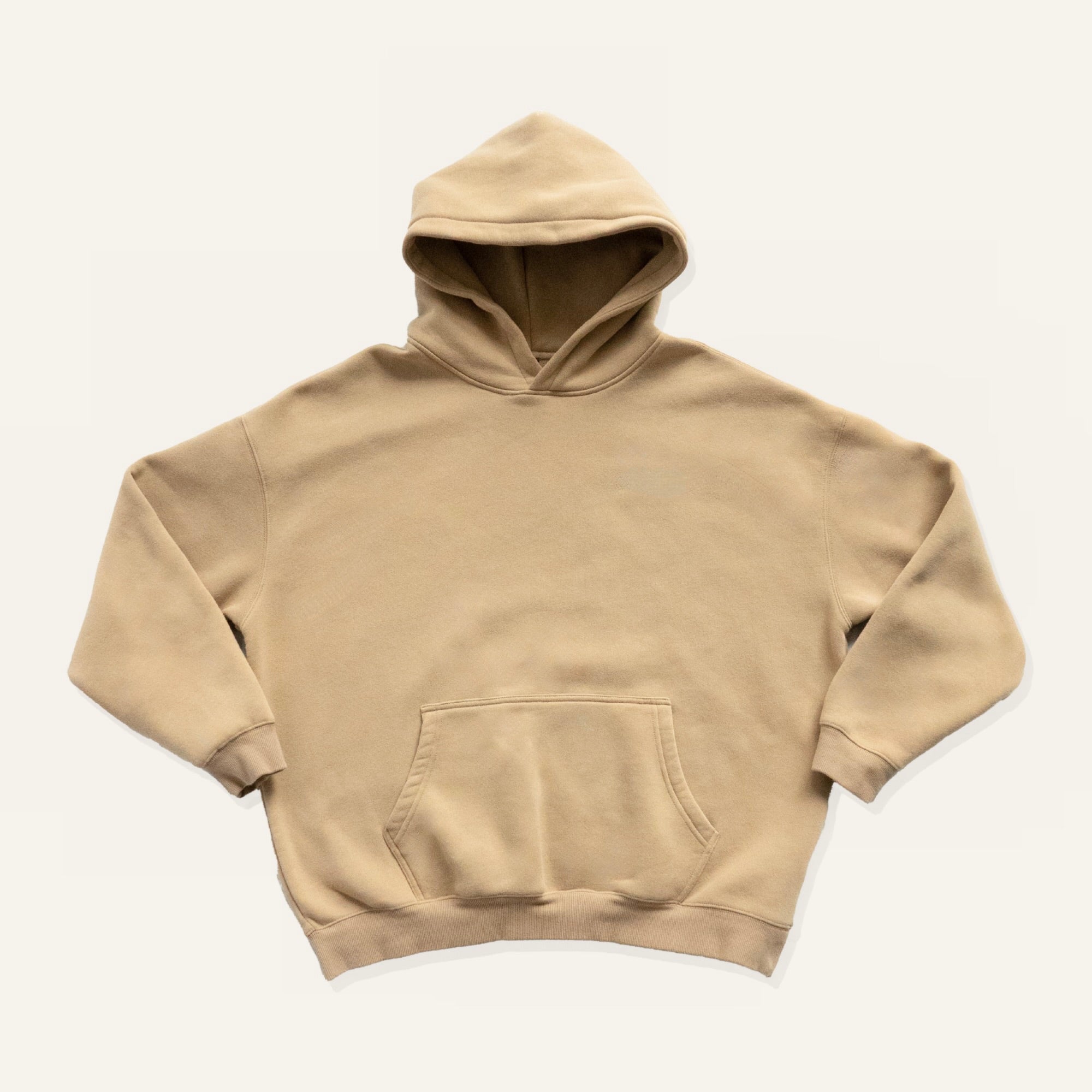 Beige hoodie on a cream background