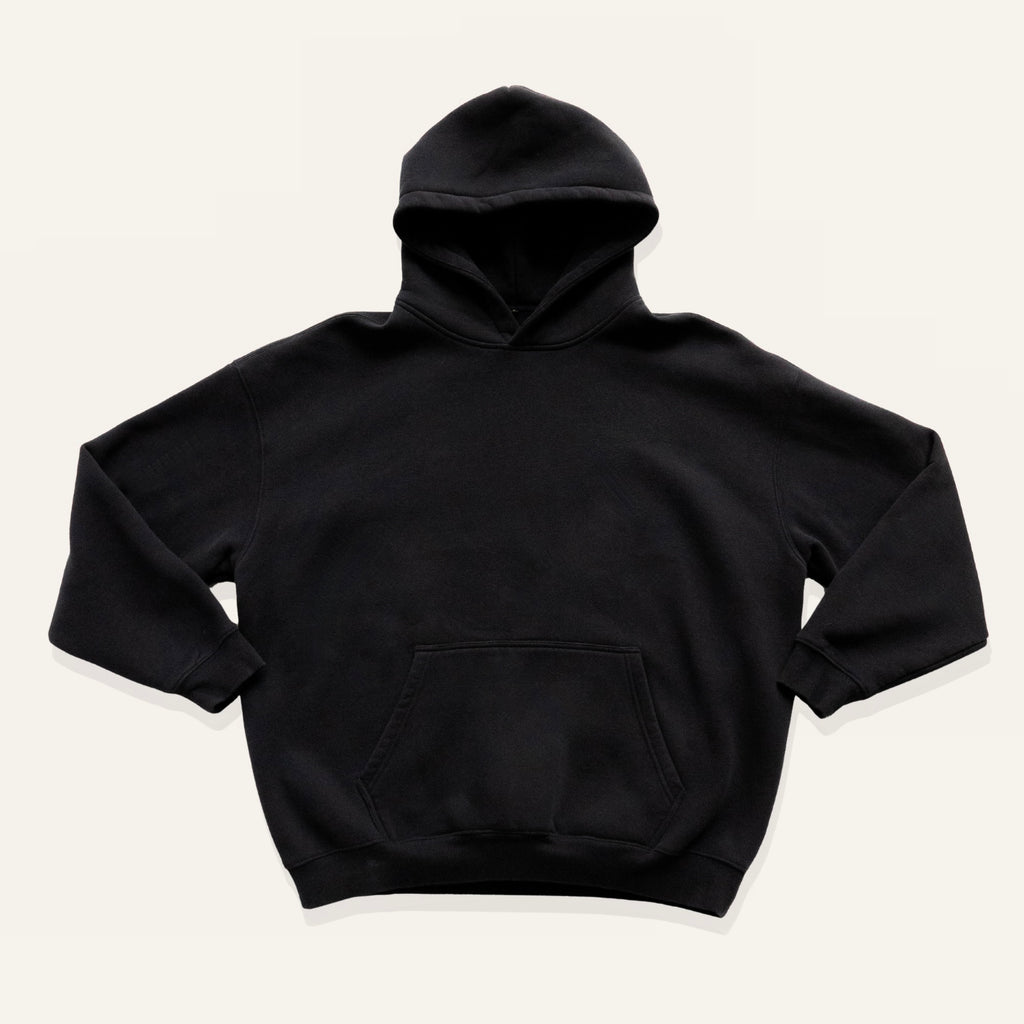 Black hoodie on a cream background