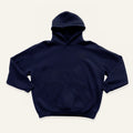 Navy hoodie on a cream background