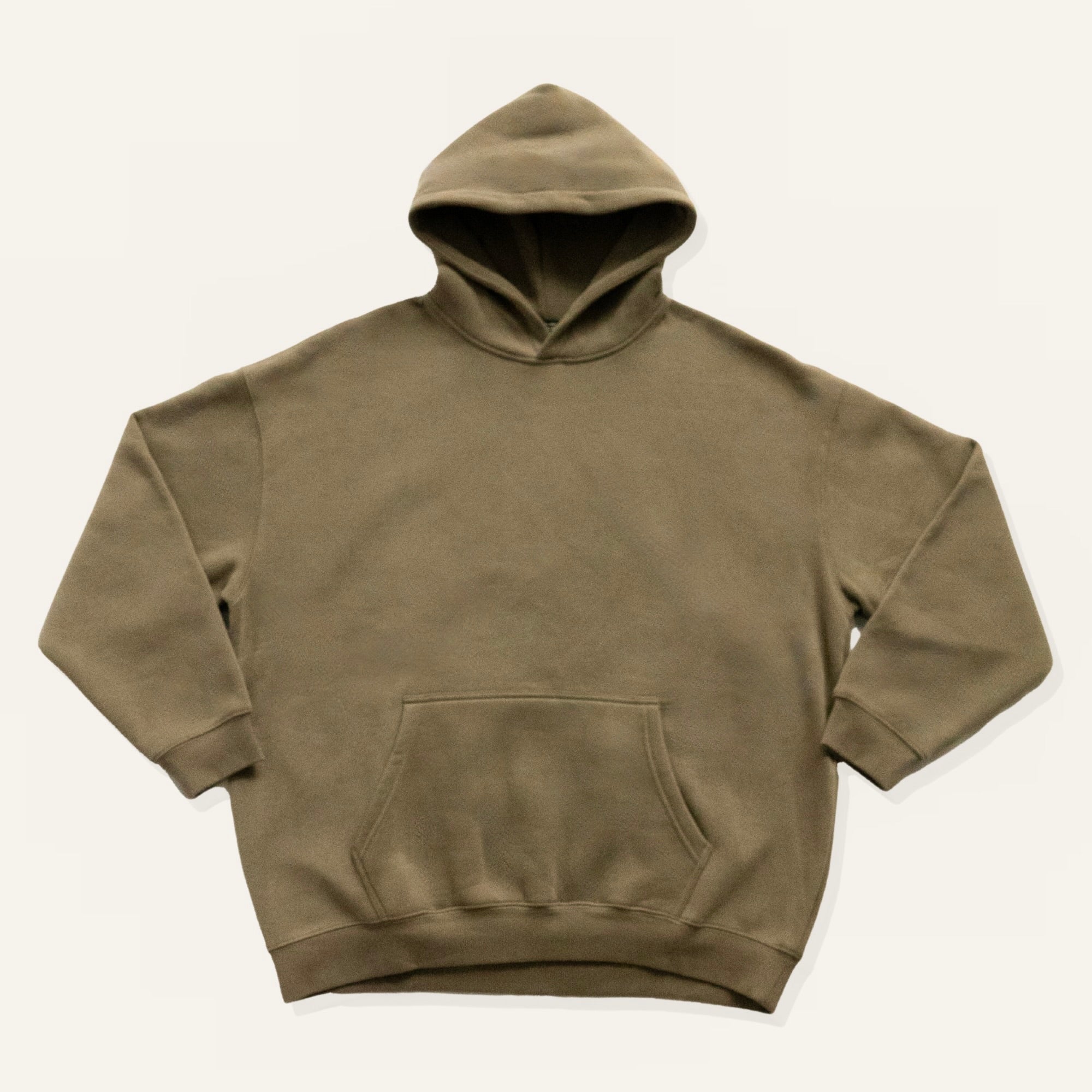 Brown hoodie on a cream background