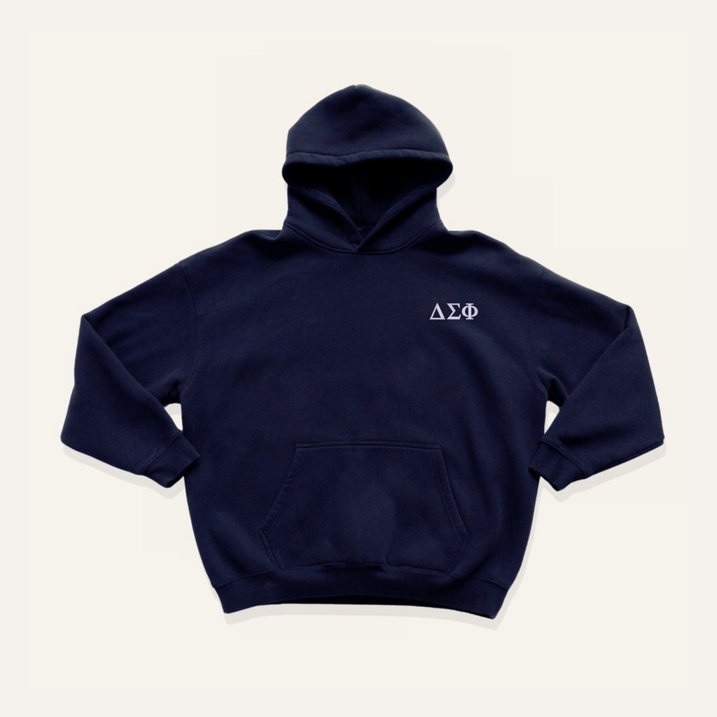 Navy blue hoodie on a cream background with 'Delta Sigma Phi' greek letters in white on the right side chest.