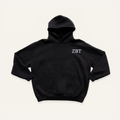Black hoodie on a cream background with 'Zeta Beta Tau' greek letters on the right side near the hood in white lettering.